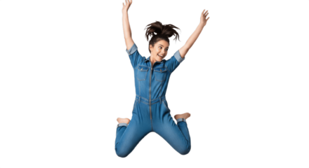 Energetic young happy woman jumping in mid-air on white background, smiling and wearing casual short denim jeans and a light top, isolated studio shot capturing joy, freedom, fitness and youthful life