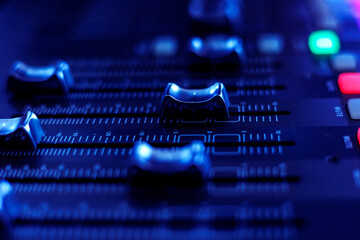 Concert sound mixer panel with volume regulators. Professional audio and light equipment for sound recording studio, live music broadcasting, television, party. mixing console. audio signals