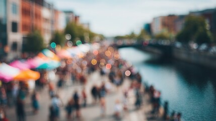 Obraz premium Vibrant outdoor market by a river with a bustling crowd and colorful bokeh