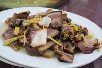 Cantonese cuisine - cured pork meat with ginger served in a restaurant in rural Guangdong, China.