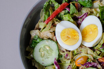 Healthy raw vegetable salad with boiled egg