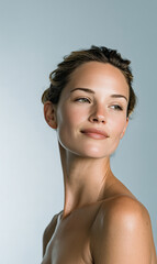 Fresh-faced woman with soft natural glow for contemporary skincare and beauty campaign
