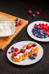 Delicious Golden Pancakes with Fresh Berries and Cream, Perfect Breakfast