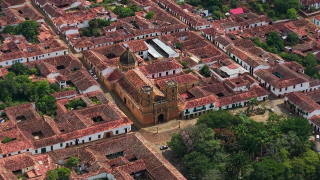 aerial circle pan drone shot of picturesque colonial town of barichara, santander, with its traditional red tiled roofs