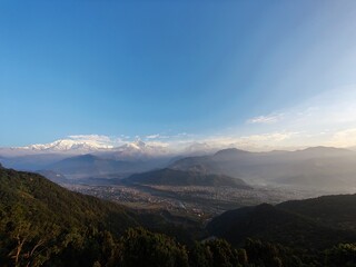 Panoramic View of Pokhara Valley Majestic Mountains and Verdant Hills under Clear Blue Sky