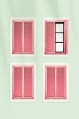 Beautiful wooden Windows on light green wall and pink shutters, modern home facade design with palm leaf shadow, second-story floor. Minimal summer pastel aesthetics, vintage creative backgrounds