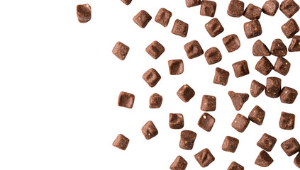 A scattered arrangement of small. square chocolate pieces on a clean white background. their rich color and texture. ideal for culinary use or dessert presentations