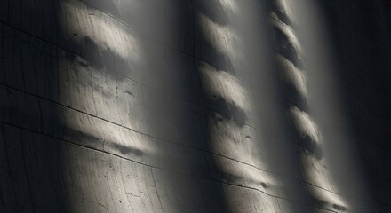 Abstract pattern of light and shadow on a textured surface.
