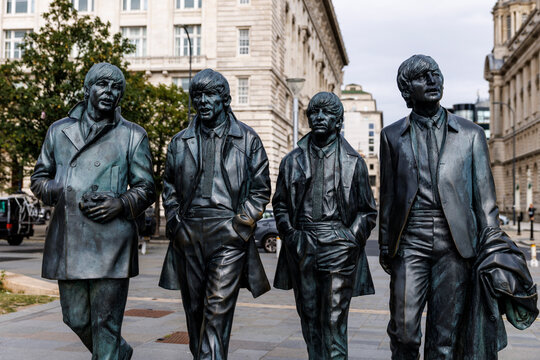 Bronze Beatles statues on Liverpool waterfront street
