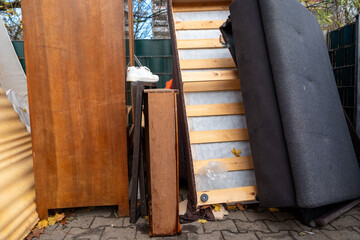 bulky waste reduction, large pile discarded furniture and wooden panels, renovation or decluttering process, used things on street, municipal waste management, diverted for recycling, pollution nature