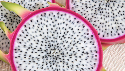 Slicing dragon fruit fresh produce market food photography bright environment close-up perspective exotic flavor exploration