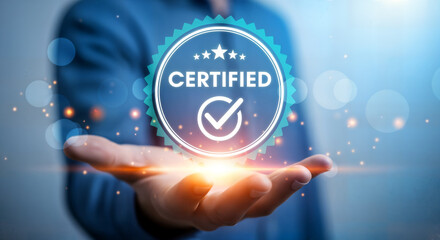 Hand presenting a glowing blue certified badge, symbolizing quality, guarantee, and accreditation