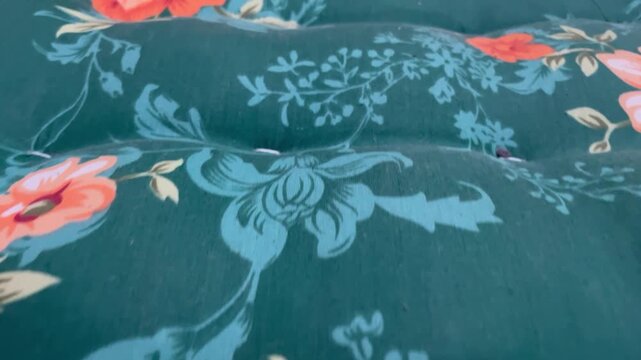 A close-up video of a traditional Indonesian kapok mattress showing the distinctive texture of the fabric.