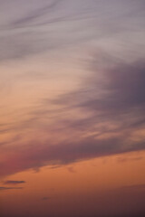 Magical late afternoon sunset sky glowing gently across softly colored clouds