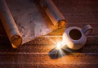 Old oil lamp and scroll