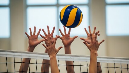 Volleyball game action players reaching for ball over net