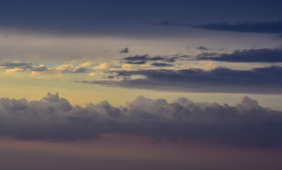 Radiant sunset sky painting gentle clouds with magical late afternoon colors