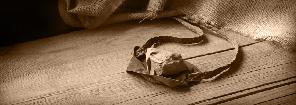 Old sling with a stone