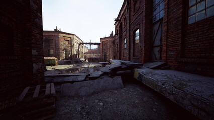 Broken pavement leads through an old industrial site filled with brick buildings. Sunlight shines down, illuminating the debris and creating a hauntingly quiet atmosphere.