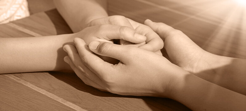 Close-up view of comforting hands