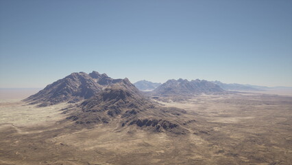Breathtaking mountains rise majestically from the arid desert, their rugged peaks contrasting against a clear blue sky. The vast landscape stretches endlessly, evoking a sense of adventure.