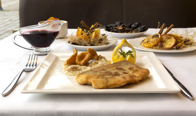 Christmas fried fish in breadcrumbs with chanterelle mushrooms and dumplings