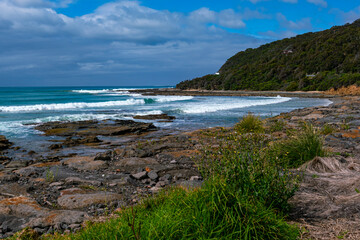 The surf crashing against the rocks and the beautiful coastline at the Great Ocean Road, Australia.