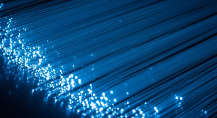 Illuminated fiber optics glow creating a modern tech aesthetic, perfect for innovation, data, and network designs with electric blue light trails