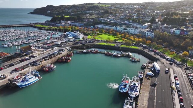 Beautiful aerial of Howth port and promenade, sunny autumn morning, Dublin Ireland.