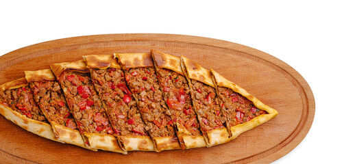 Turkish pide with minced meat and veggies on a wooden board