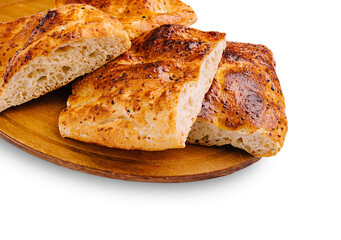Freshly baked artisan bread on a wooden platter in a warm kitchen
