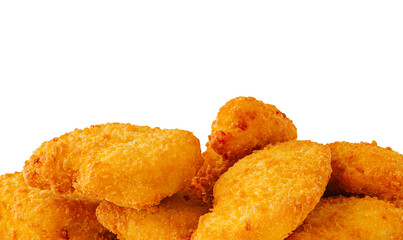 Crispy golden chicken nuggets piled high on a plain background