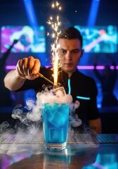 Bartender preparing a blue cocktail with sparkler and dry ice for a party or celebration event