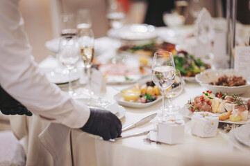 Elegant dining experience featuring exquisite cuisine and fine table settings during a formal event at a luxurious venue in the evening