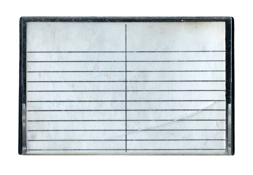 Isolated vintage cracked plastic cassette tape case with lined paper