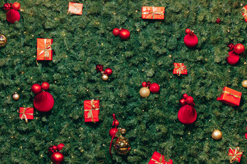 Close-up of a decorated Christmas tree with red and gold ornaments