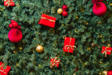 Close-up of a decorated Christmas tree with red and gold ornaments