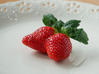 Twin Strawberries on a White Plate