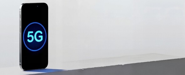 Smartphone displaying 5G network symbol on screen. Mobile technology concept with copy space. High speed internet connection background