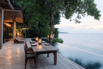 Outdoor dinner setup on tropical terrace near swimming pool