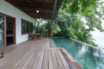Relaxing tropical dinner on terrace overlooking pool