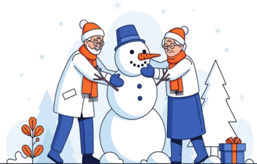 Senior Couple Building Snowman Outdoors in Winter - Holiday Activity