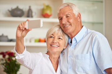 Selfie, smile and senior couple in home for memory, profile picture and bonding for online post. Retirement, marriage and elderly man and woman in kitchen for photo, social media and happy for love