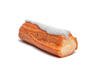 A single eclair pastry with a choux dough shell, creamy filling, and white fondant icing is shown against a plain white background.