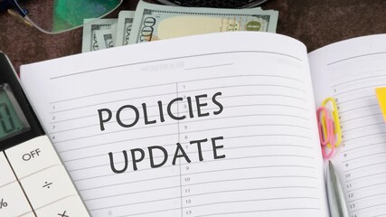 Animation and appearance of the conceptual phrase POLICIES UPDATE in a business notebook. Policies Update text concept.