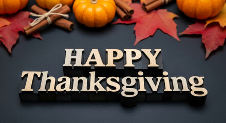 Wooden letters spell "Happy Thanksgiving" with gourds, cinnamon sticks, and colorful leaves, celebrating autumn harvest and grateful sentiment