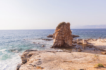 Coastal rock formation and cliffs on rocky mediterranean sea shore