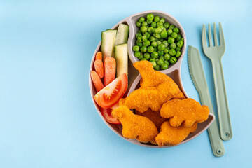 Tasty kids food, dinosaur shaped chicken nuggets