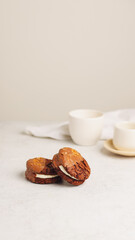 Decadent Chocolate Sandwich Cookies with Cream Filling and Toffee Topping