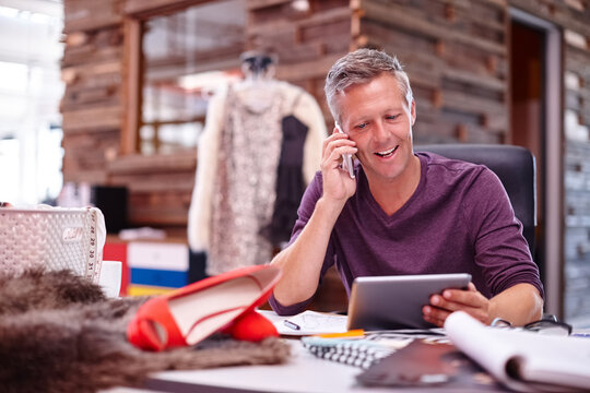 Happy man, fashion designer and tablet with phone call for clothing design, online order or prep. Male person, tailor or seamstress talking with technology or mobile smartphone for fabric service